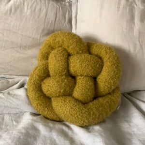 Decorative mustard knot pillow